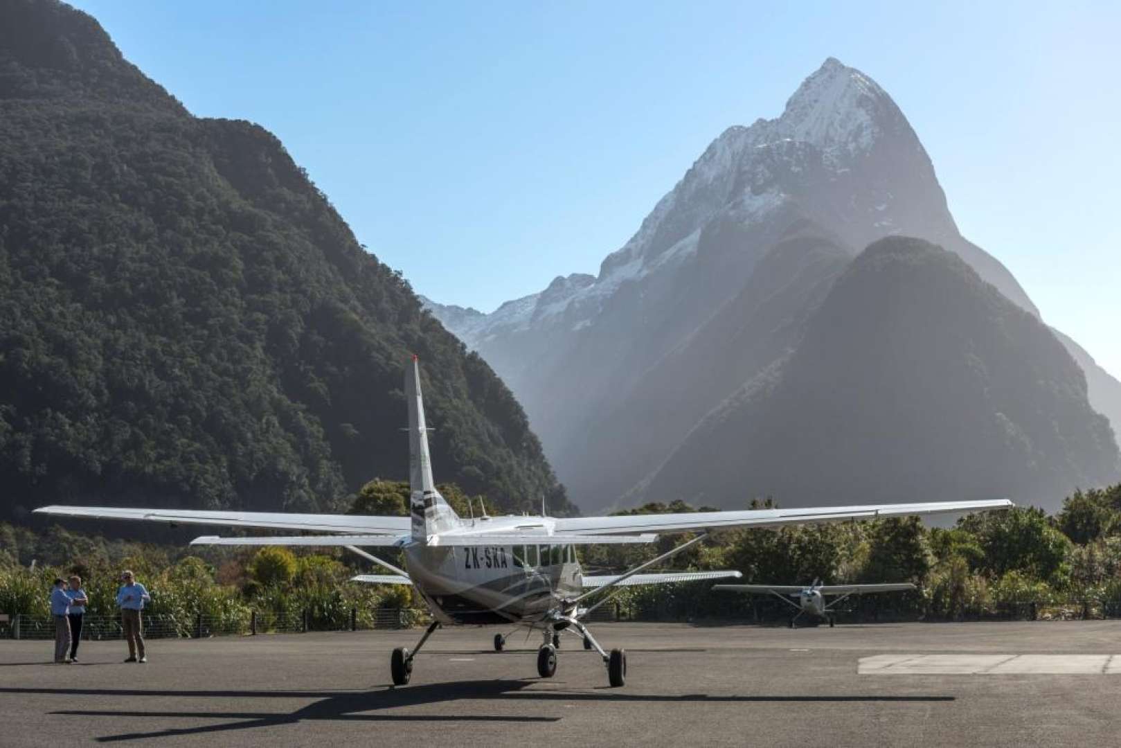 Air Milford landing at the Milford Sound runway with Mitre Peak in the background