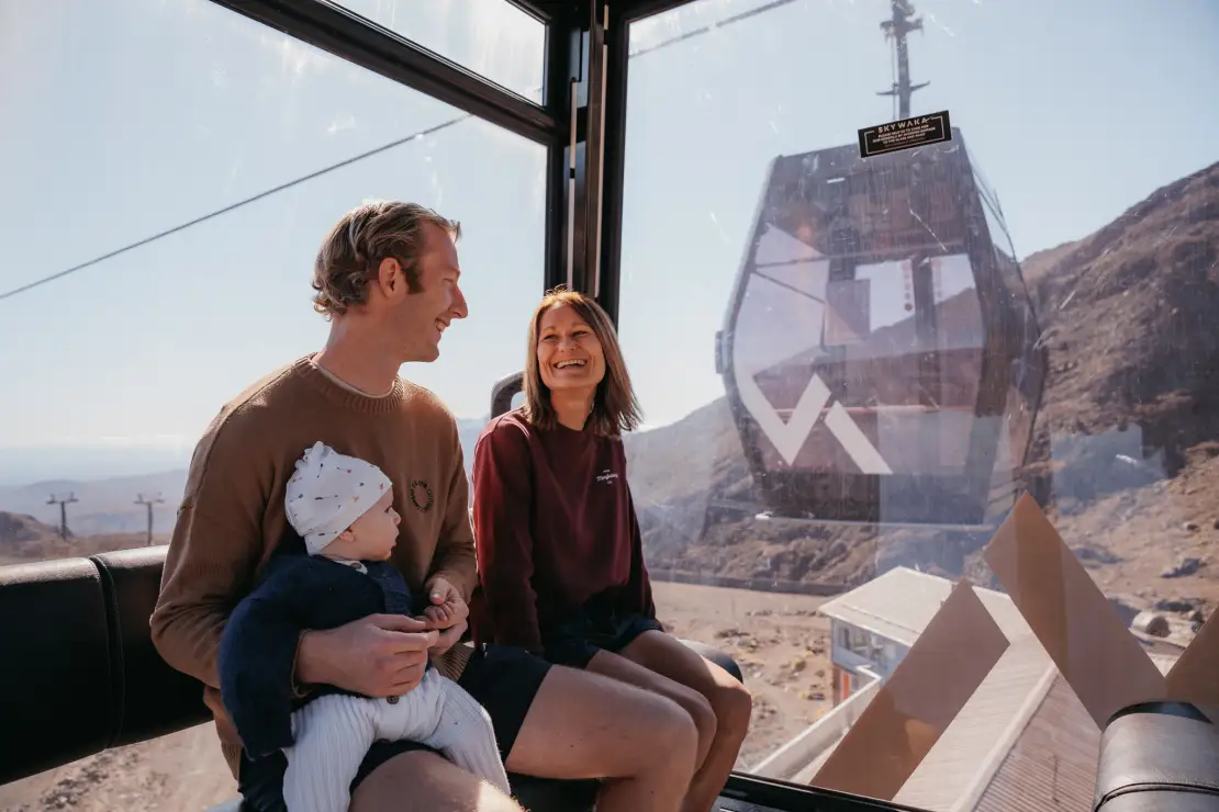 A happy family at the top of the Sky Waka gondola