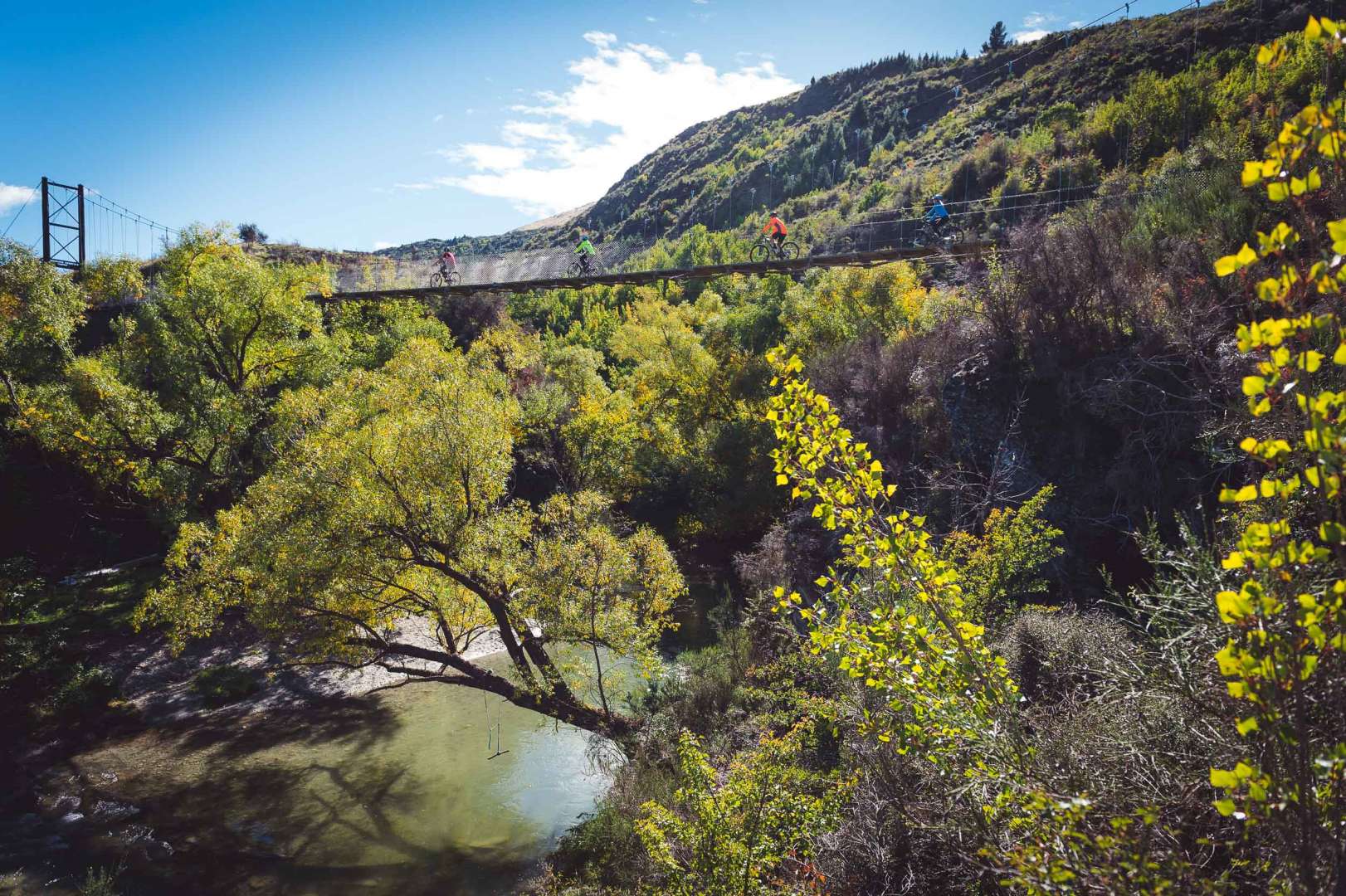 Scenic morning bike ride along the beautiful Arrow and Kawarau Rivers to the Kawarau Suspension Bridge