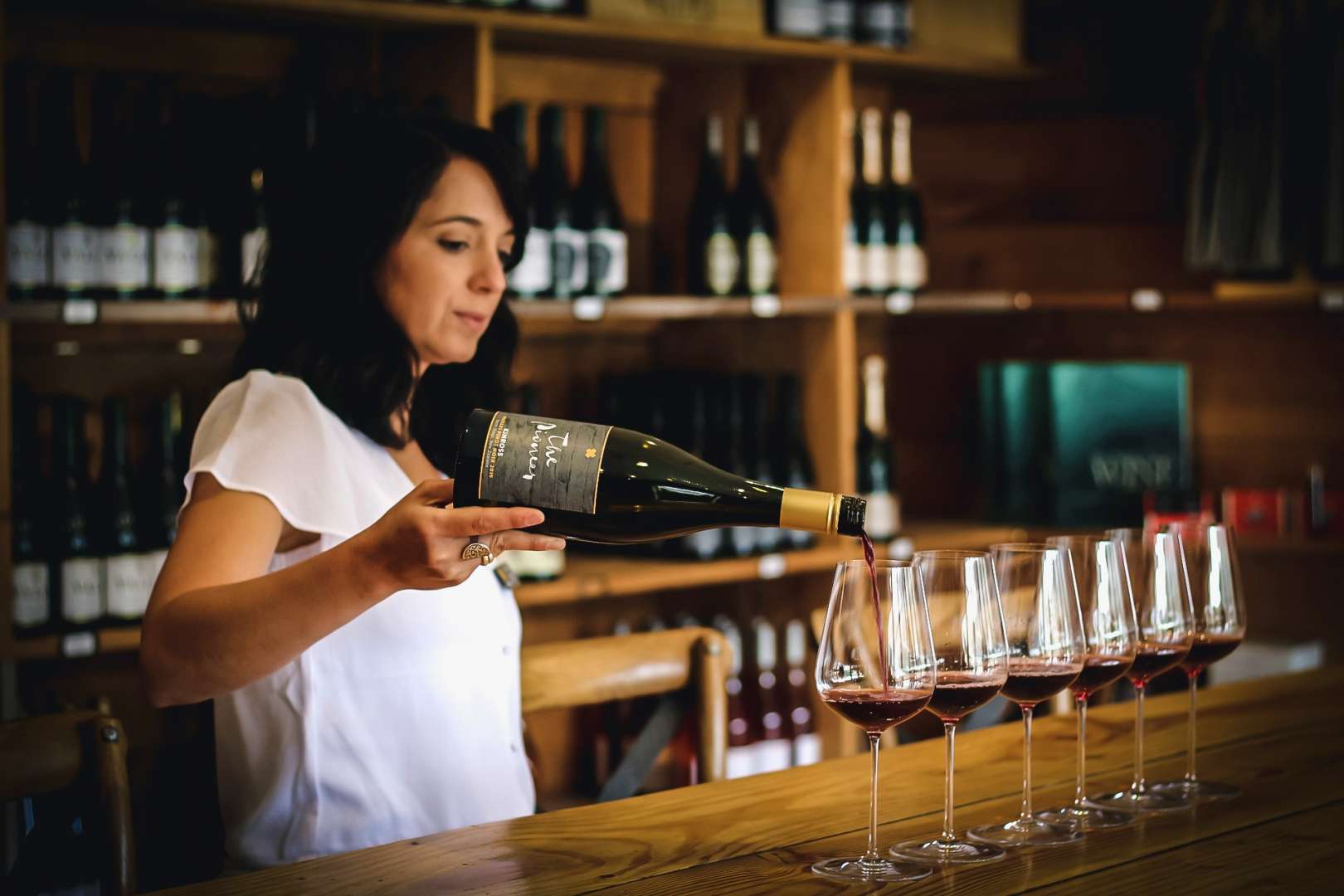 Sommelier pouring Pinot Noir tastings