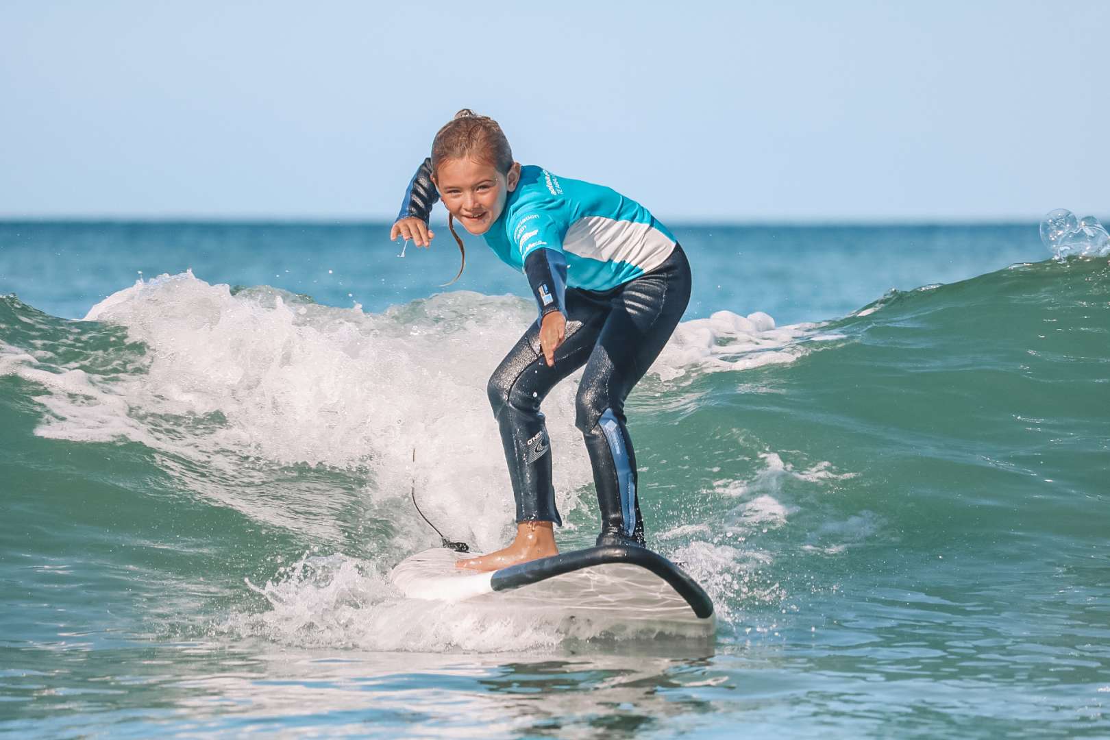 Surf lessons held at Te Arai, the East Coasts #1 surf beach with crystal clear water and white sand!